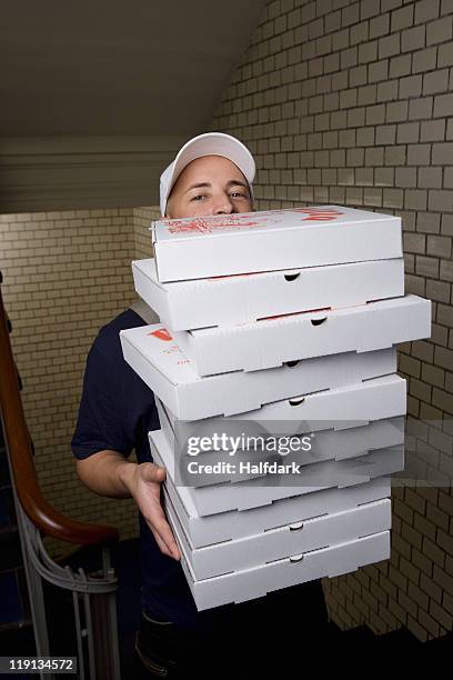 a pizza delivery man, portrait - home delivery stock pictures, royalty-free photos & images