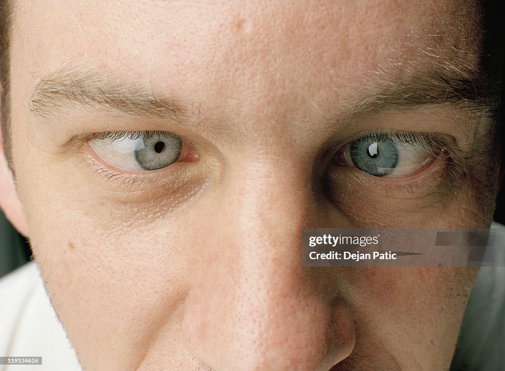 Close-up of a man with eyes crossed