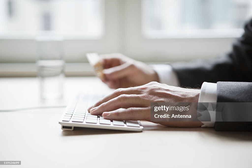 Businessman hands typing