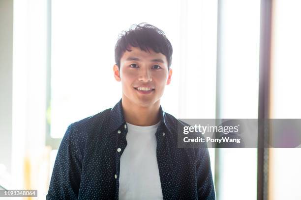 young man look to you - japanse man stock pictures, royalty-free photos & images