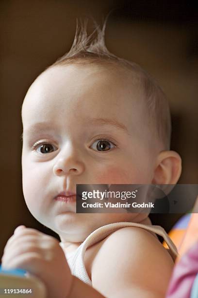 a baby looking seriously into the camera - voronezh stock pictures, royalty-free photos & images