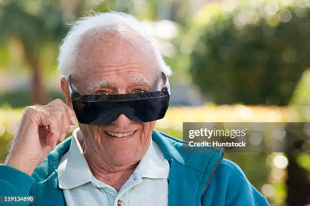 portrait-of-a-senior-man-wearing-cataract-dark-glasses.webp