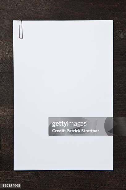 paper clipped blank paper - paper clip stock pictures, royalty-free photos & images