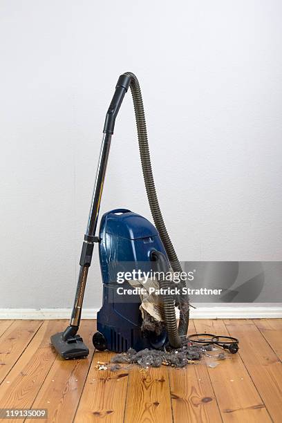 vacuum cleaner with an exploded vacuum cleaner bag - saugen stock-fotos und bilder