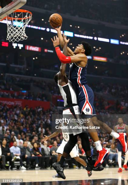 Rui Hachimura of the Washington Wizards dunks the ball as Patrick Beverley of the Los Angeles Clippers defends during the first half at Staples...