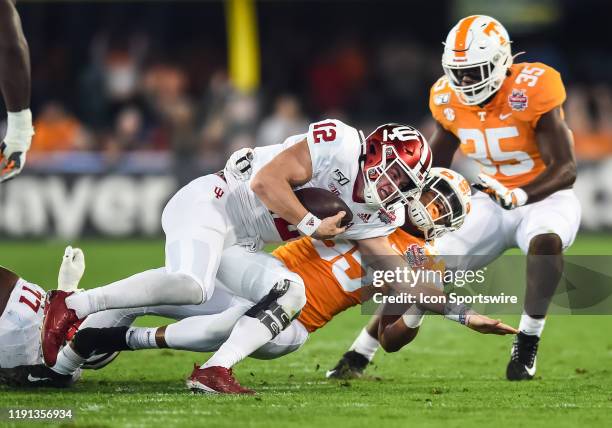 Tennessee Volunteers linebacker Kivon Bennett tackles Indiana Hoosiers quarterback Peyton Ramsey during the TaxSlayer Gator Bowl on January 2 at TIAA...