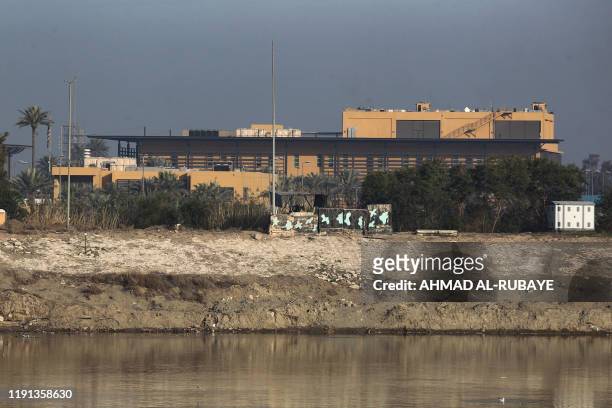 General view shows the US embassy across the Tigris river in Iraq's capital Baghdad on January 3, 2020. The US embassy in Baghdad urged American...