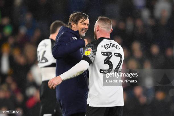 Phillip Cocu, Manager of Derby County talks with Wayne Rooney of Derby County during the Sky Bet Championship match between Derby County and Barnsley...