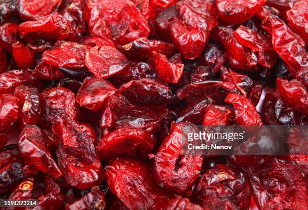 close-up of dried cranberries background - クランベリー ストックフォトと画像