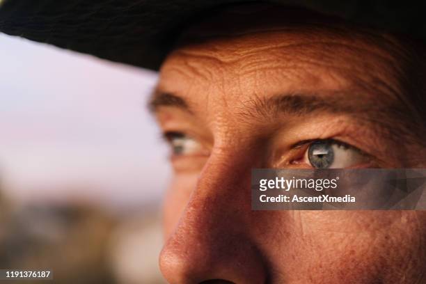 portrait of a park guide in the mountains at sunrise - extreme close up face stock pictures, royalty-free photos & images