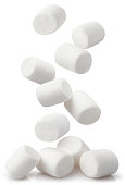 Falling marshmallows on white