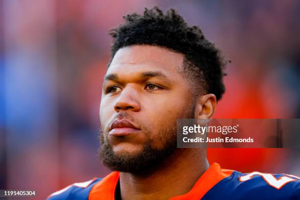 Running back Devontae Booker of the Denver Broncos stands on the field before a game against the Los Angeles Chargers at Empower Field at Mile High...