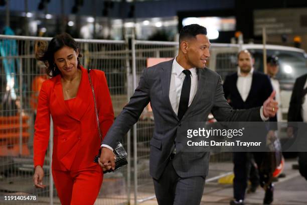 Maria Folau holds hands with husband Israel Folau as he acknowledges a supporter as he leaves Federal Court on December 02, 2019 in Melbourne,...