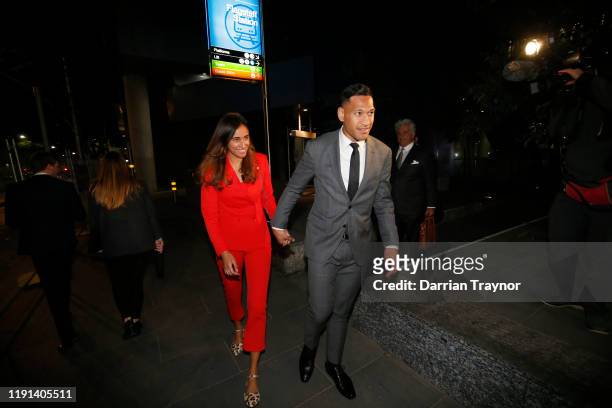 Maria Folau holds hands with husband Israel Folau as he leaves Federal Court on December 02, 2019 in Melbourne, Australia. Folau is meeting with...