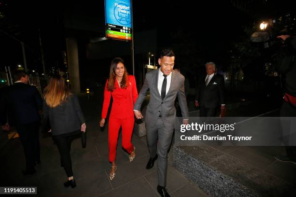 Maria Folau holds hands with husband Israel Folau as he leaves Federal Court on December 02, 2019 in Melbourne, Australia. Folau is meeting with...