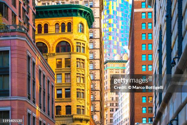 close-up of different style buildings in manhattan, new york city - wall street lower manhattan stock pictures, royalty-free photos & images