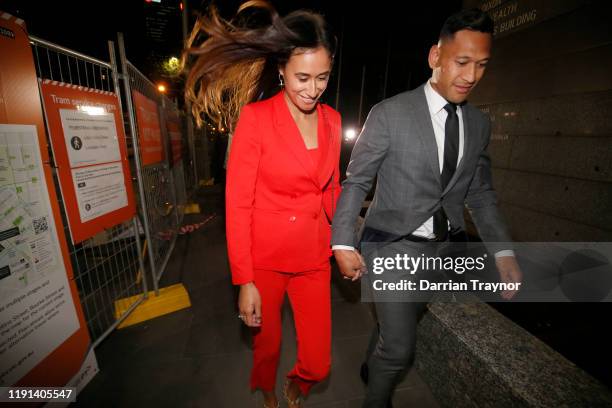 Maria Folau holds hands with husband Israel Folau as he leaves Federal Court on December 02, 2019 in Melbourne, Australia. Folau is meeting with...