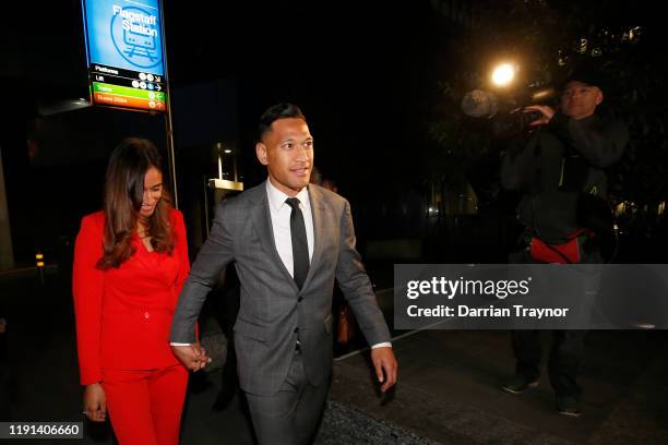 Maria Folau holds hands with husband Israel Folau as he leaves Federal Court on December 02, 2019 in Melbourne, Australia. Folau is meeting with...