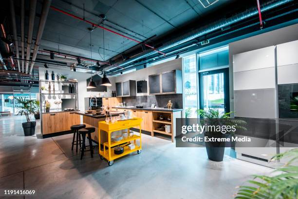 a modern interior kitchen design set up in a home improvement store - loja de utensílios de cozinha imagens e fotografias de stock