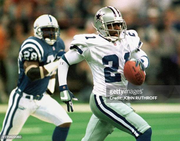 Dallas Cowboys cornerback Deion Sanders outdistances Indianapolis Colts defensive back Tito Wooten to score a touchdown in the first quarter of their...