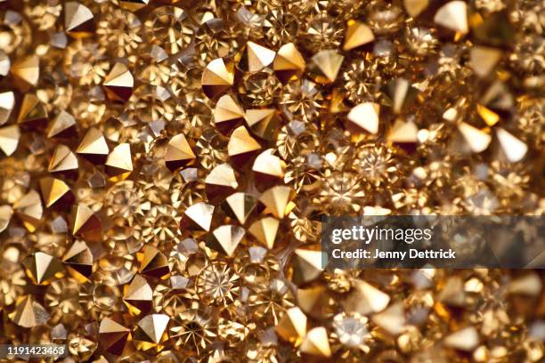 gold rhinestones - rhinestone stock pictures, royalty-free photos & images