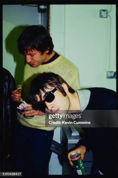 English singer-songwriter Liam Gallagher of rock band Oasis with American musician Evan Dando of rock band The Lemonheads at an in-store promotion...