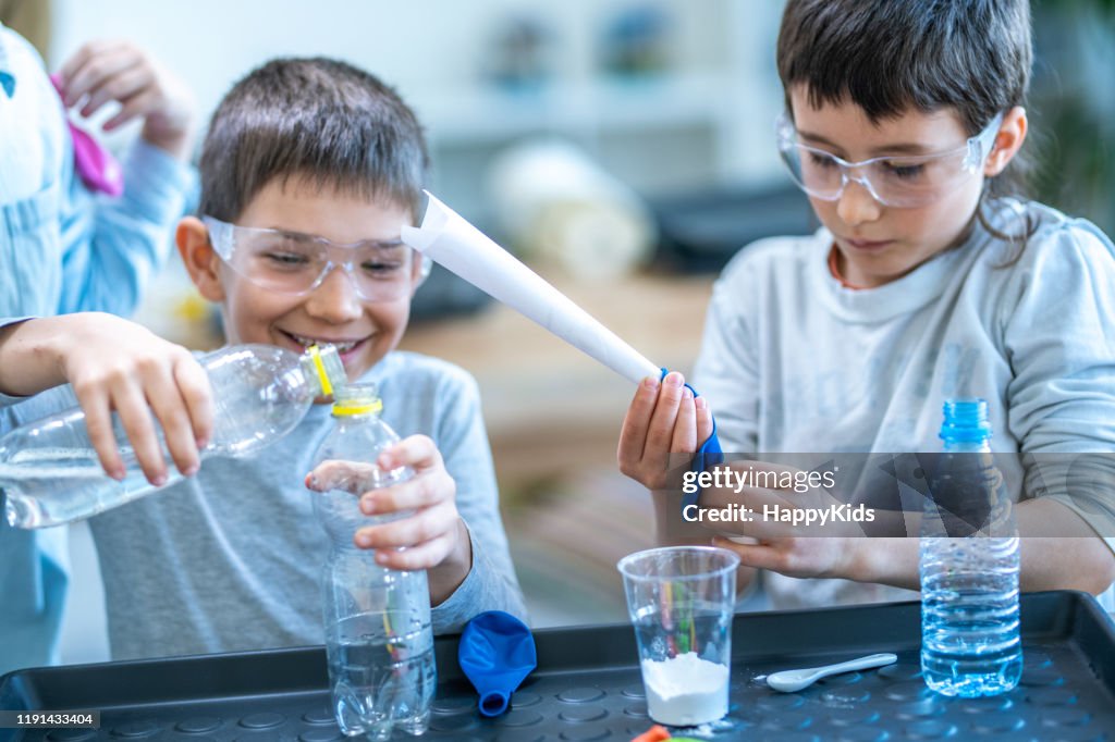 Students Doing Science Experiment In Laboratory High-Res Stock Photo ...