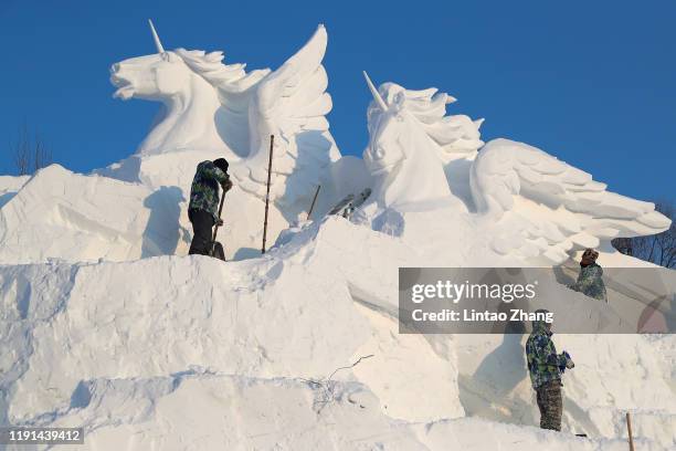 The snow sculptures of the 32nd sun island snow Expo are under production on January 3, 2020 in Harbin, China. Harbin Ice Sculpture Festival is one...