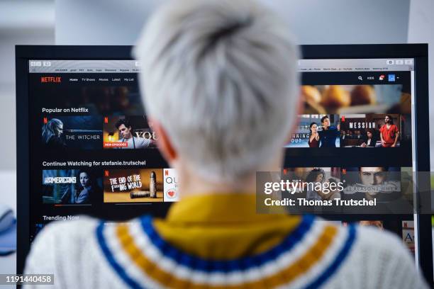 Berlin, Germany A woman looks at Netflix in the office at her desk on January 03, 2020 in Berlin, Germany.