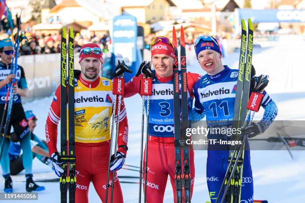 Sergey Ustiugov of Russia, Alexander Bolshunov of Russia and Iivo Niskanen of Finland in the finish during the Men's 15 km C Pursuit at the FIS...