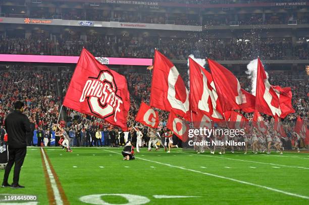 National Semifinals: Ohio State cheerleaders on field with flags during game vs Clemson at University of Phoenix Stadium. Glendale, AZ CREDIT: Nils...