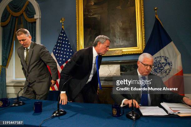 New York Mayor Bill de Blasio leaves the press conference next to NYPD Police Commissioner Dermot Shea and John Miller, Deputy Commissioner of...