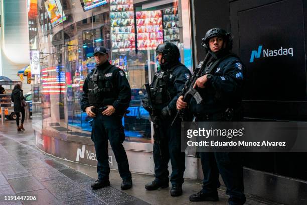 Counterterrorism officers stand guard at Times Square on January 3, 2020 in New York City. The NYPD will take actions to protect the city and...
