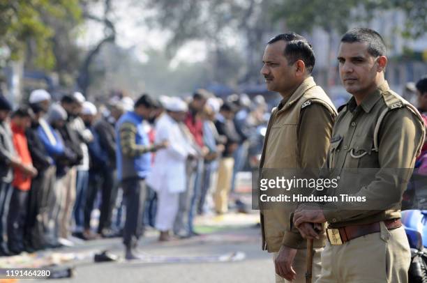Noida Police personnel stand guard while Friday namaz is offered at Sector 8 Jama Masjid on January 3, 2020 in Noida, India.