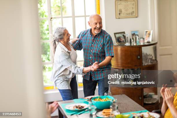 dancing like the first day they met - senior man dancing on table stock pictures, royalty-free photos & images