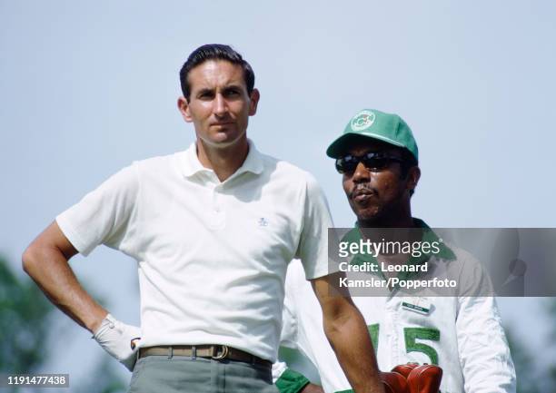 Bob Charles, New Zealand left-handed golfer and national sporting hero, with his caddy during the US Masters Golf Tournament at the Augusta National...