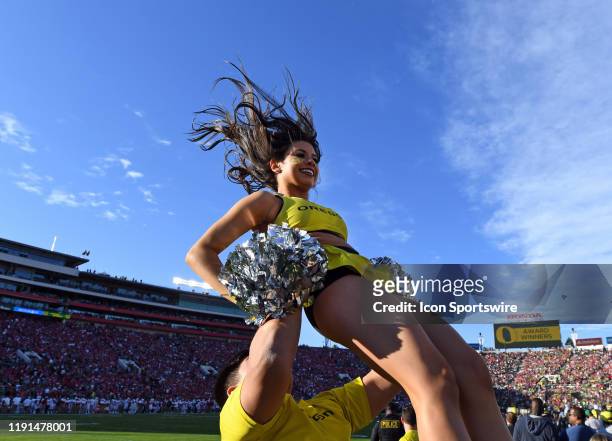 Oregon Ducks cheerleader in the air during the Rose Bowl game played on January 1, 2020 against the Wisconsin Badgers at the Rose Bowl in Pasadena,...