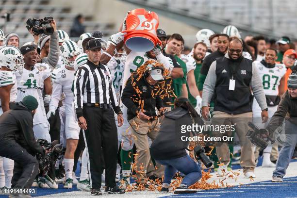 Head Coach Frank Solich of the Ohio Bobcats gets showered with french fries during second half action against the Nevada Wolf Pack at the Famous...