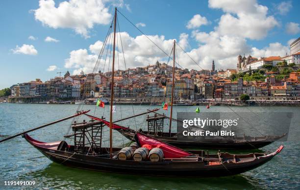 porto cityscape  with rabelo boats on douro river, portugal - rabelo boat stock pictures, royalty-free photos & images