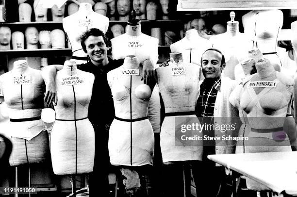 Portrait of life partners and fashion designers Bob Mackie and Ray Aghayan as they pose with an array of mannequins, Los Angeles, California, circa...