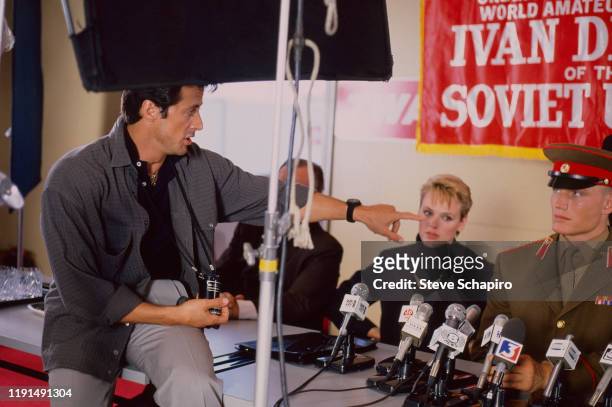 View of American actor and director Sylvester Stallone, Danish actress Brigitte Nielsen, and Swedish actor Dolph Lundgren during the filming of...
