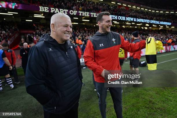 Warren Gatland, Coach of the Barbarians talks with Sam Warburton, Breakdown Coach of Wales following the international friendly match between Wales...