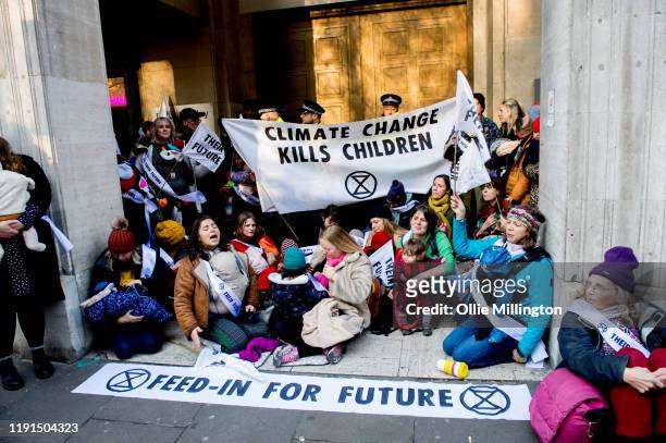 Extinction Rebellion Climate Crisis activist mothers with young children take part in a ’nurse-in’ breast feeding protest outside The Brexit Party...