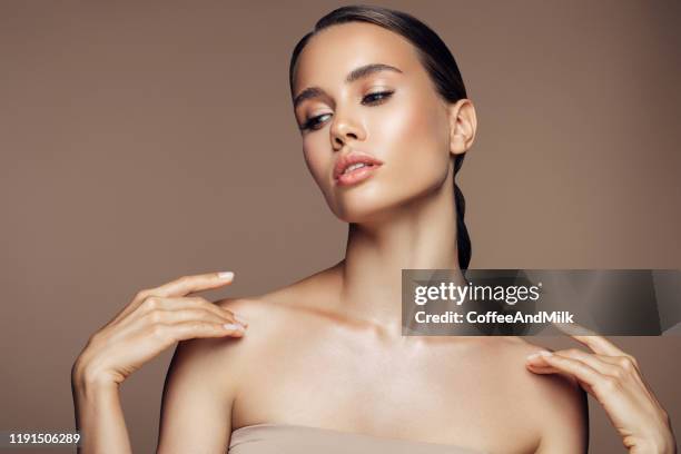 gorgeous woman posing on camera - plastic surgery body stock pictures, royalty-free photos & images