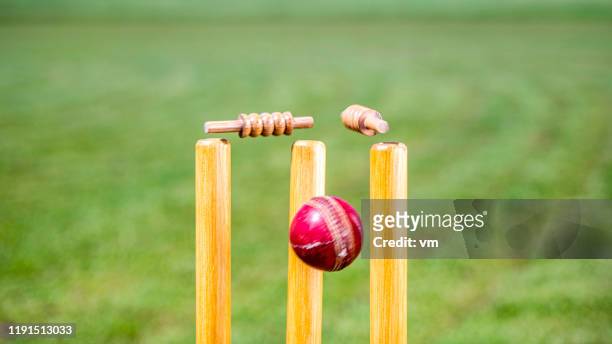 cricket ball hitting the stumps - cricket stock pictures, royalty-free photos & images