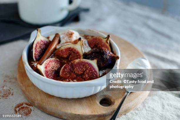 oven baked spicy figs with whipped cream - fig stock pictures, royalty-free photos & images