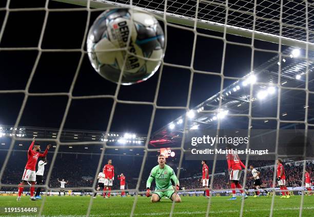 Robin Zentner of 1. FSV Mainz 05 reacts as Martin Hinteregger of Eintracht Frankfurt scores his team's first goal during the Bundesliga match between...