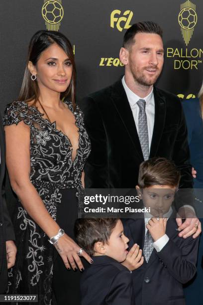 Antonella Roccuzzo and husband Lionel Messi attend the photocall during the Ballon D'Or Ceremony at Theatre Du Chatelet on December 02, 2019 in...