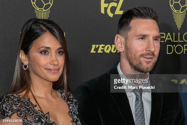 Antonella Roccuzzo and husband Lionel Messi attend the photocall during the Ballon D'Or Ceremony at Theatre Du Chatelet on December 02, 2019 in...