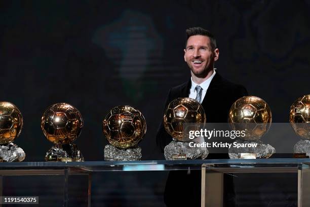 Lionel Messi poses onstage with after winning his sixth Ballon D'Or award during the Ballon D'Or Ceremony at Theatre Du Chatelet on December 02, 2019...